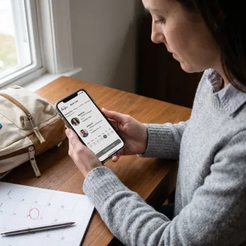Parent reviewing flexible childcare options on a phone