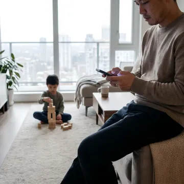 Parent booking emergency babysitting on a phone