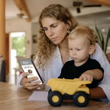 Parent using childcare benefits app