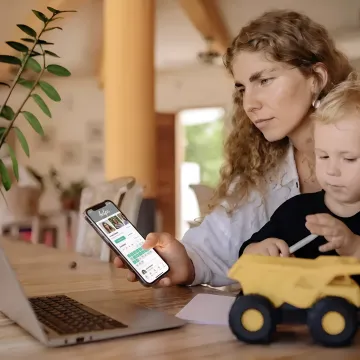 Working parent with child using childcare support