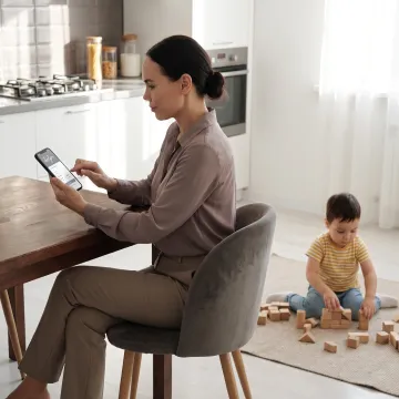 Parent using a childcare benefits app