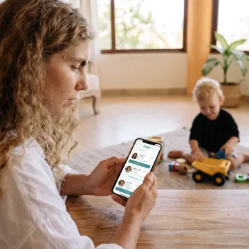 Working parent and child using a childcare support app