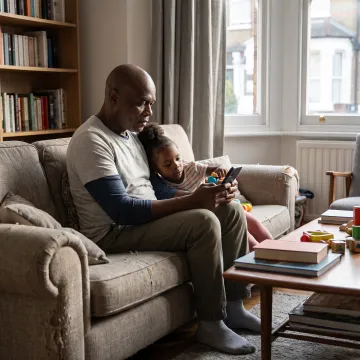 Working parent arranging child care on phone