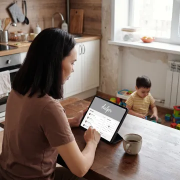 Working parent using childcare benefits app