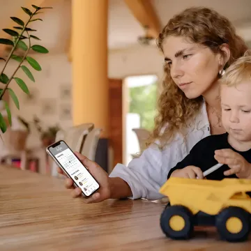Working parent using a family care app