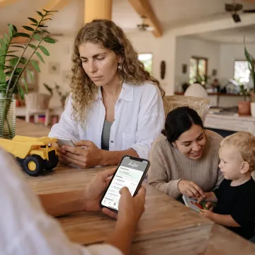 Working parent using a family care benefits app