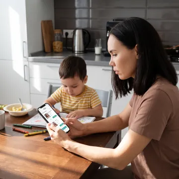 Parent arranging backup childcare on a phone