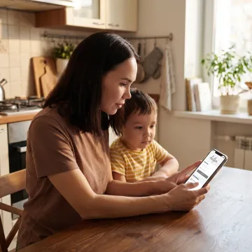 Parent using a child care benefits app