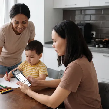 Parent reviewing childcare options on phone