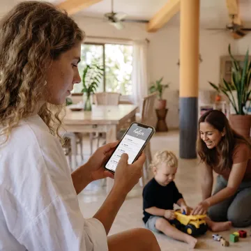 Working parent using a childcare benefits app
