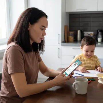 Parent using a childcare benefits app