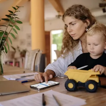 Working parent using a family care benefits app