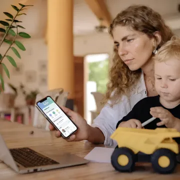 Working parent using a family care benefits app