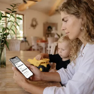 Working parent using a family care benefits app