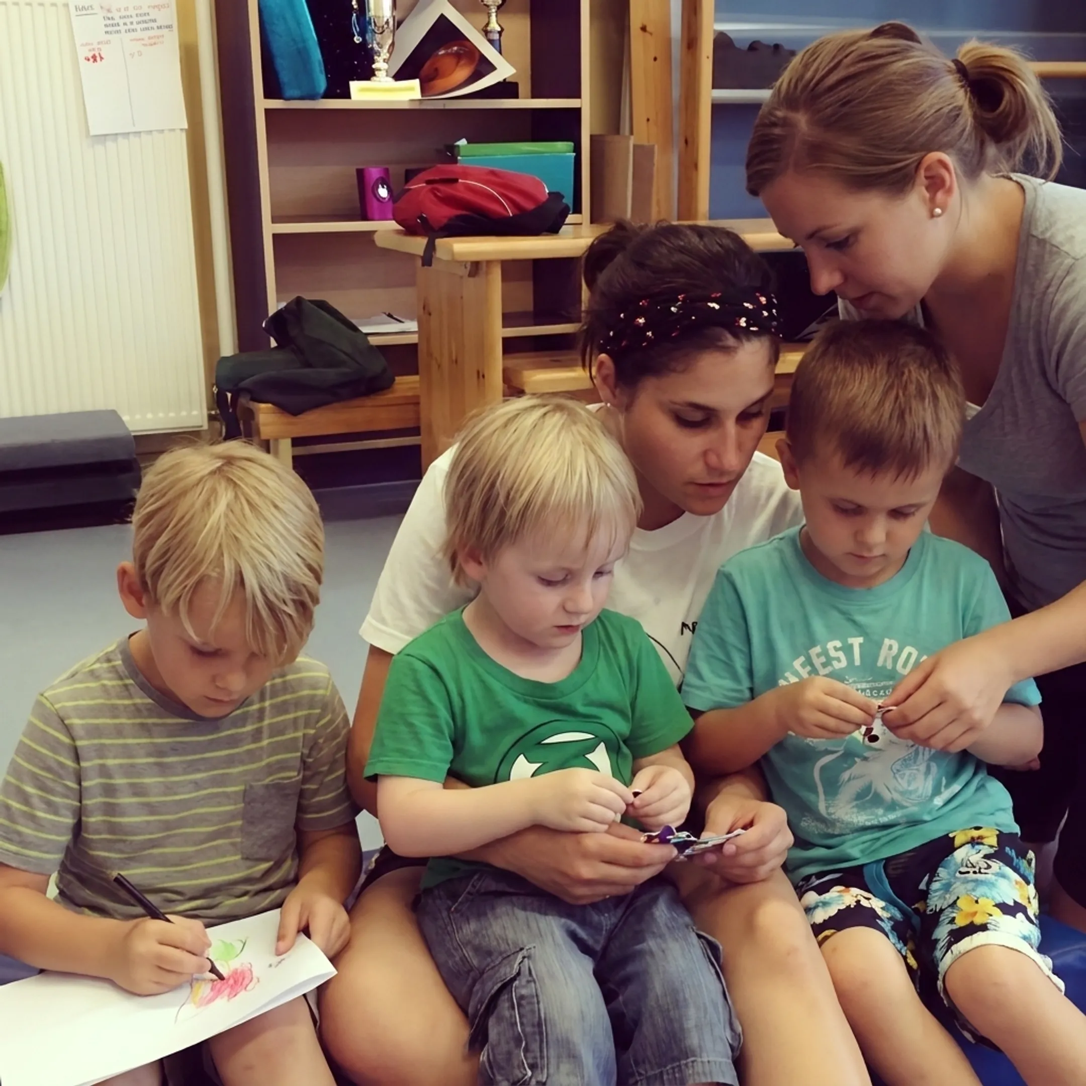 Children participating in an engaging after-school activity while caregivers supervise
