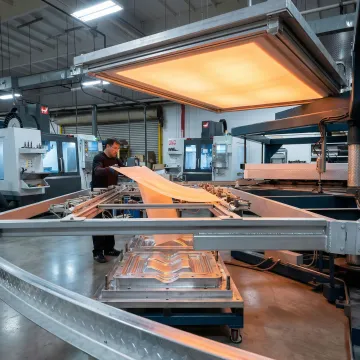 Custom HDPE plastic thermoforming production facility with industrial equipment