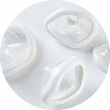 Precision plastic medical device prototypes and components displayed on a clean white surface