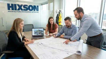 Hixson process engineering team reviewing sanitary facility design drawings in office
