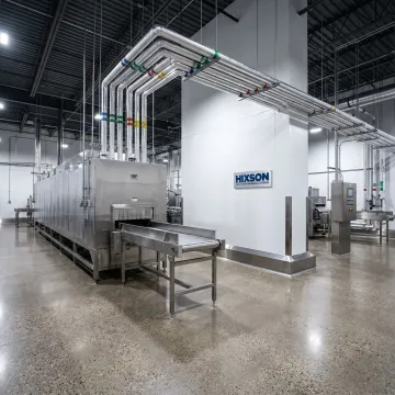 IQF tunnel freezer system in a frozen food facility