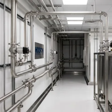 Sanitary stainless steel piping in a processing facility