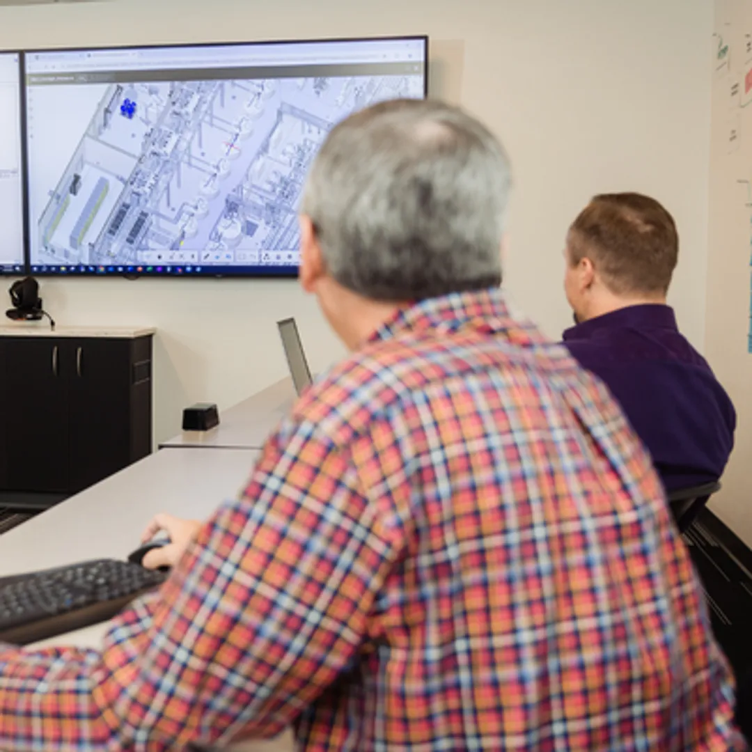 Cleanroom engineering team reviewing process plans