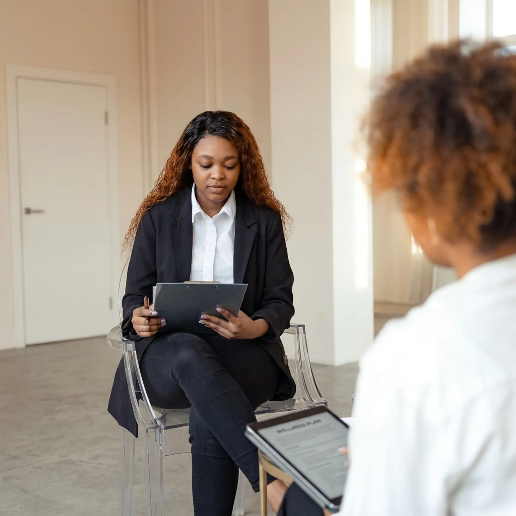 Nurse practitioner providing personalized wellness guidance to an adult patient