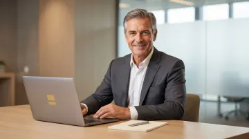 Executive professional reading newsletter on laptop with focused undivided attention