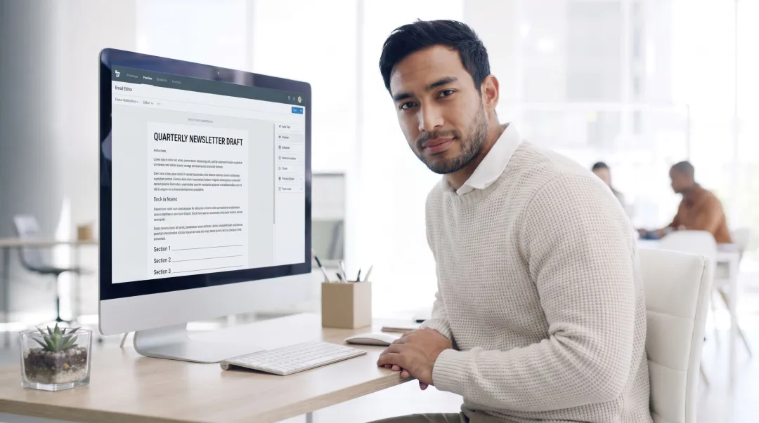 Content writer reviewing newsletter editorial tone and ad copy on laptop screen