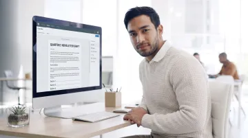 Content writer reviewing newsletter editorial tone and ad copy on laptop screen