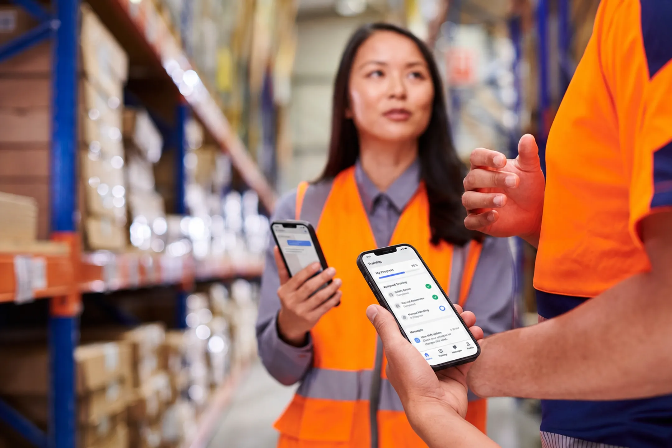 Deskless frontline employees using mobile training app on smartphone