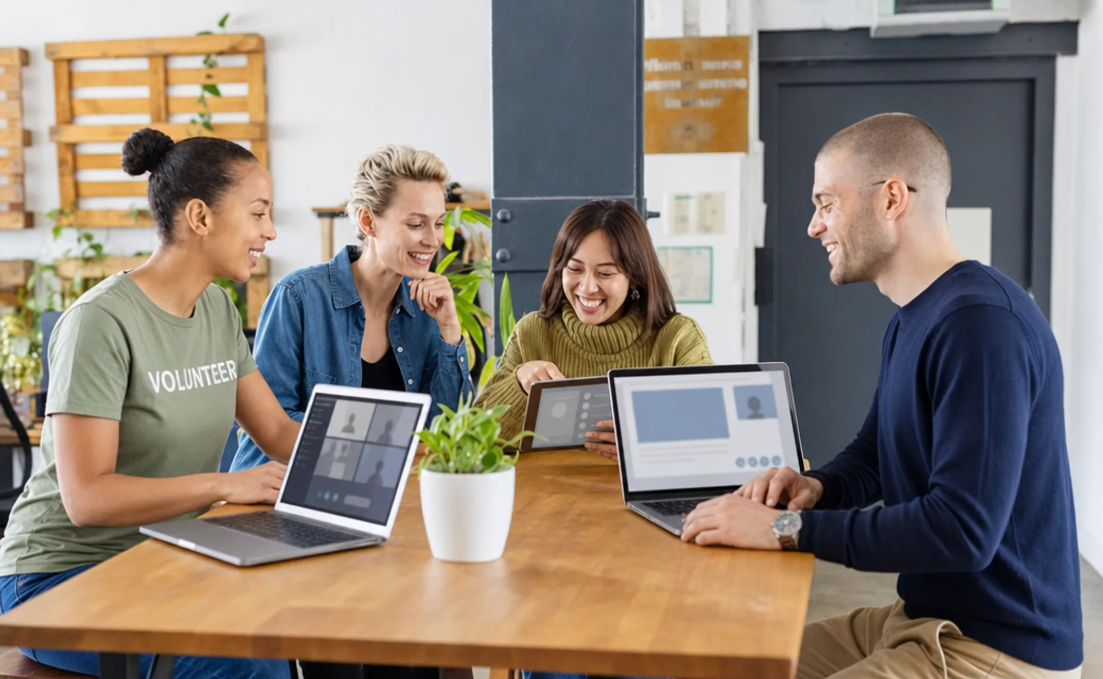 Nonprofit staff and volunteers completing online training courses on laptop
