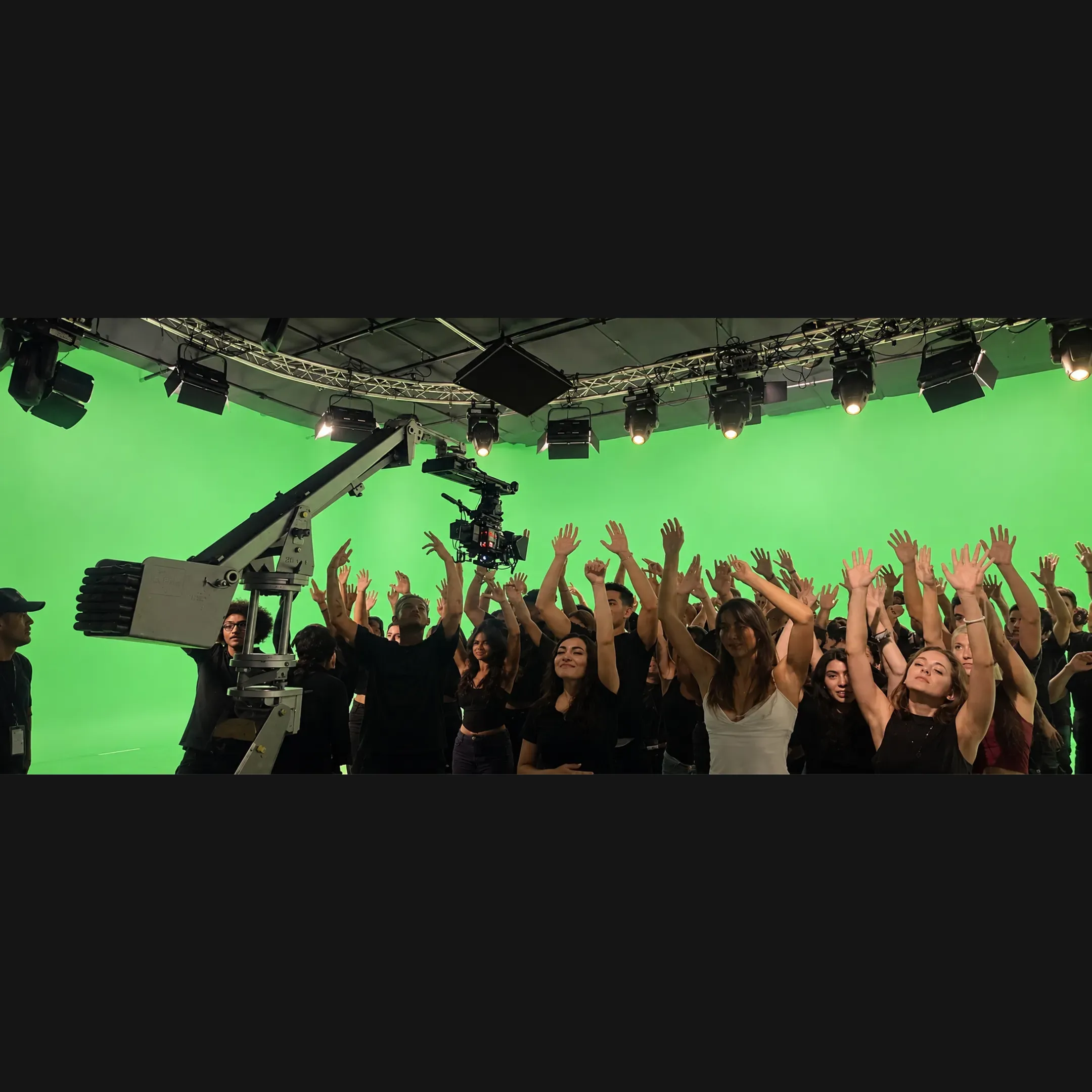 Production team lighting a green screen set