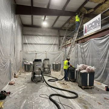 Crew preparing insulation removal work area