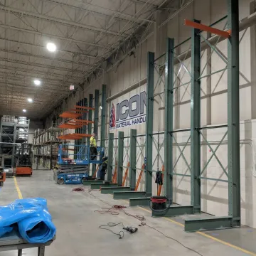 Crew installing industrial pallet racks