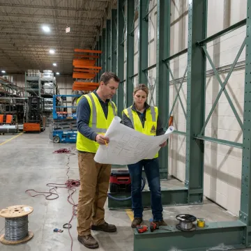 Warehouse team planning racking installation