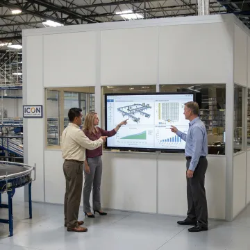 Warehouse team reviewing automation ROI plan
