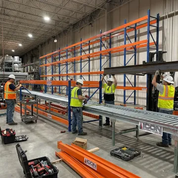 Warehouse equipment service team at work