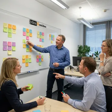 Facilitator guiding a design thinking training session