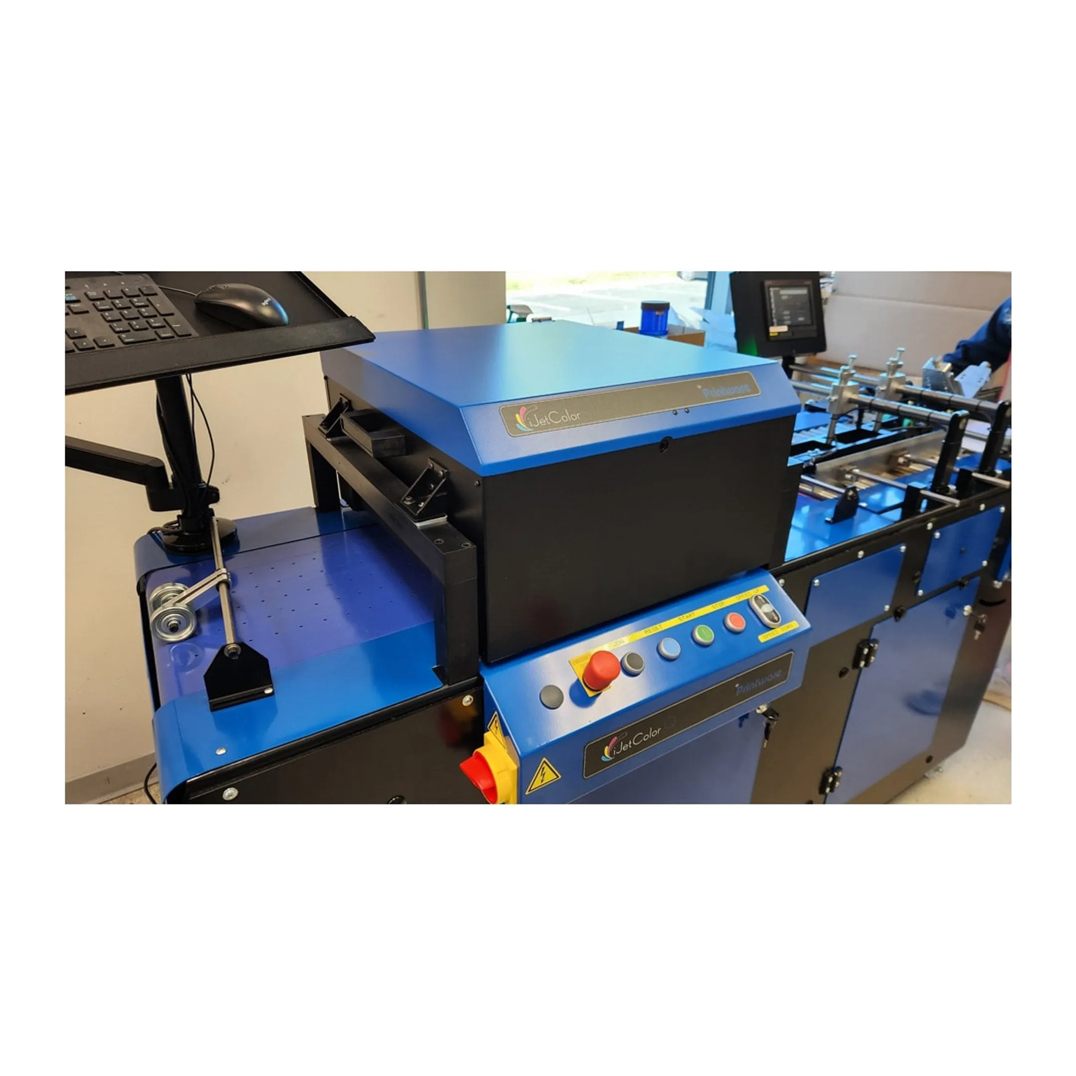 Technician setting up a commercial inkjet printer