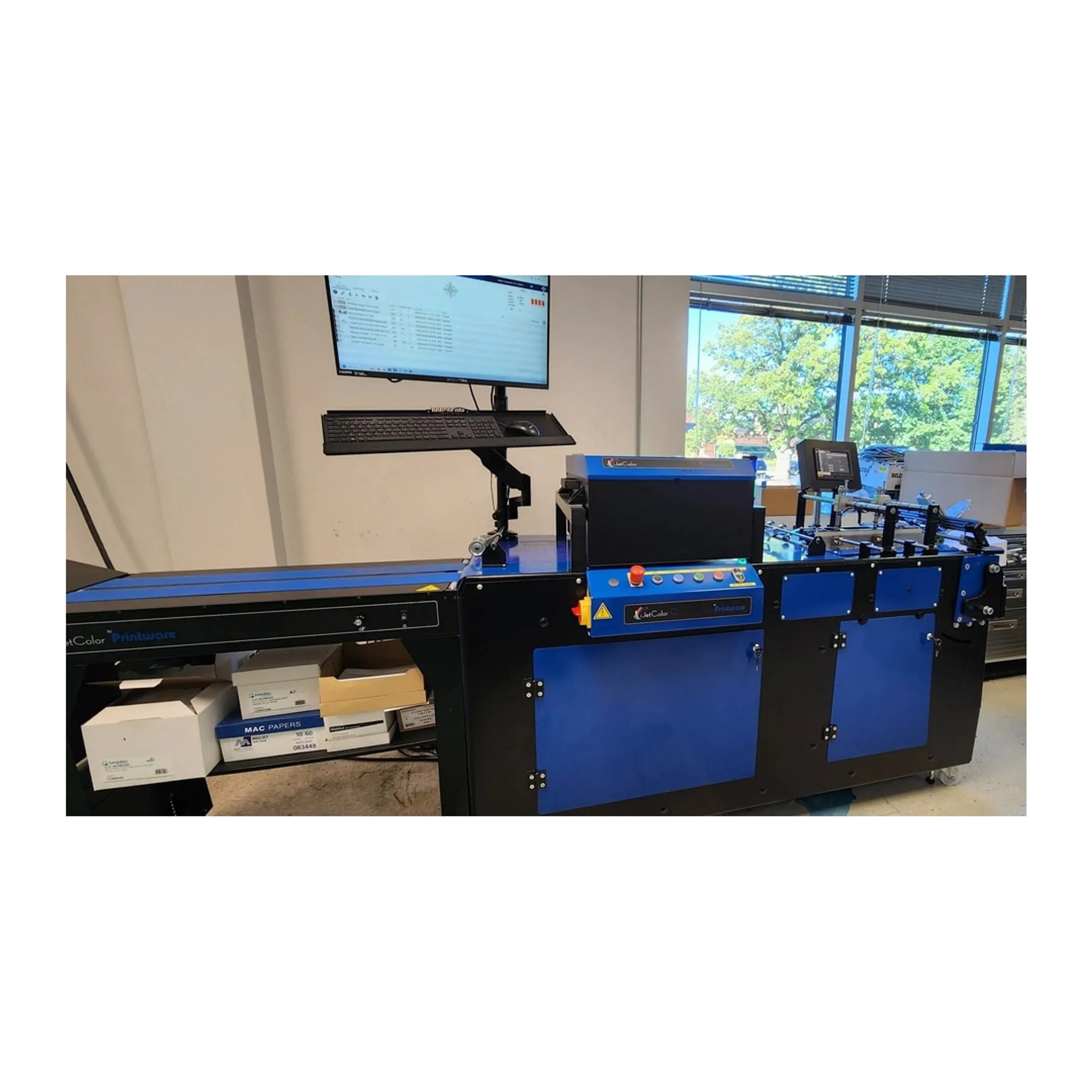 Technician assisting an inkjet printer operator