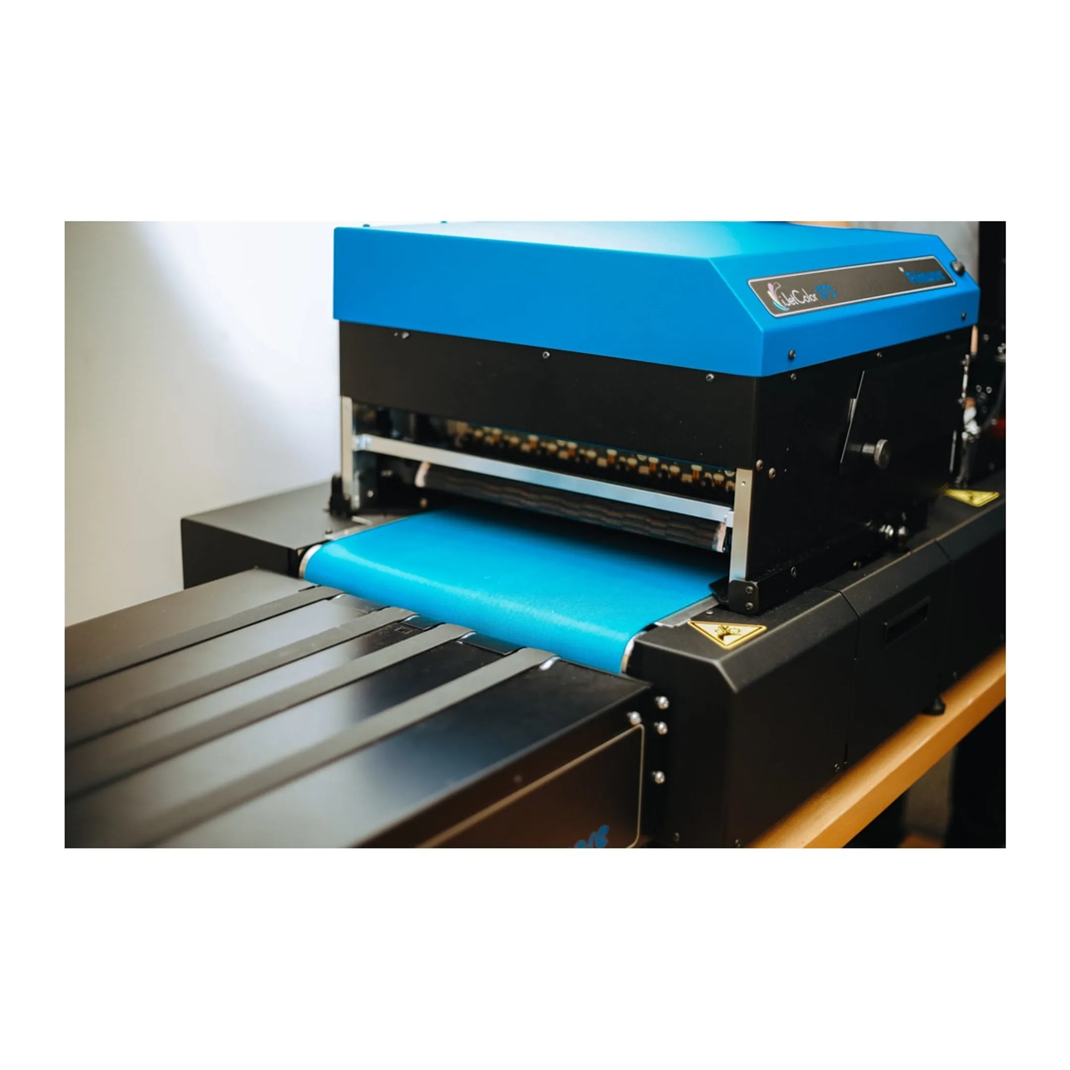 Operator reviewing colorful digital envelope print samples