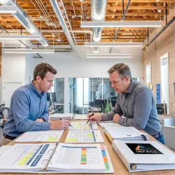 ISO 27001 certification consulting team reviewing security controls