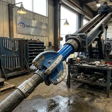 Near-bit reamer for directional drilling