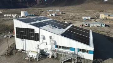 Remote Arctic microgrid installation with solar panels and diesel generators in isolated community