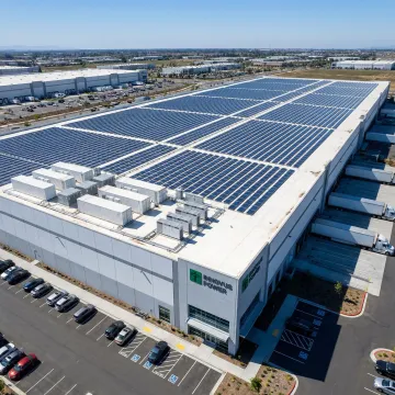 Modern commercial facility with integrated microgrid solar panels and energy storage systems