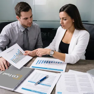 Fund manager reviewing alternative investment portfolio