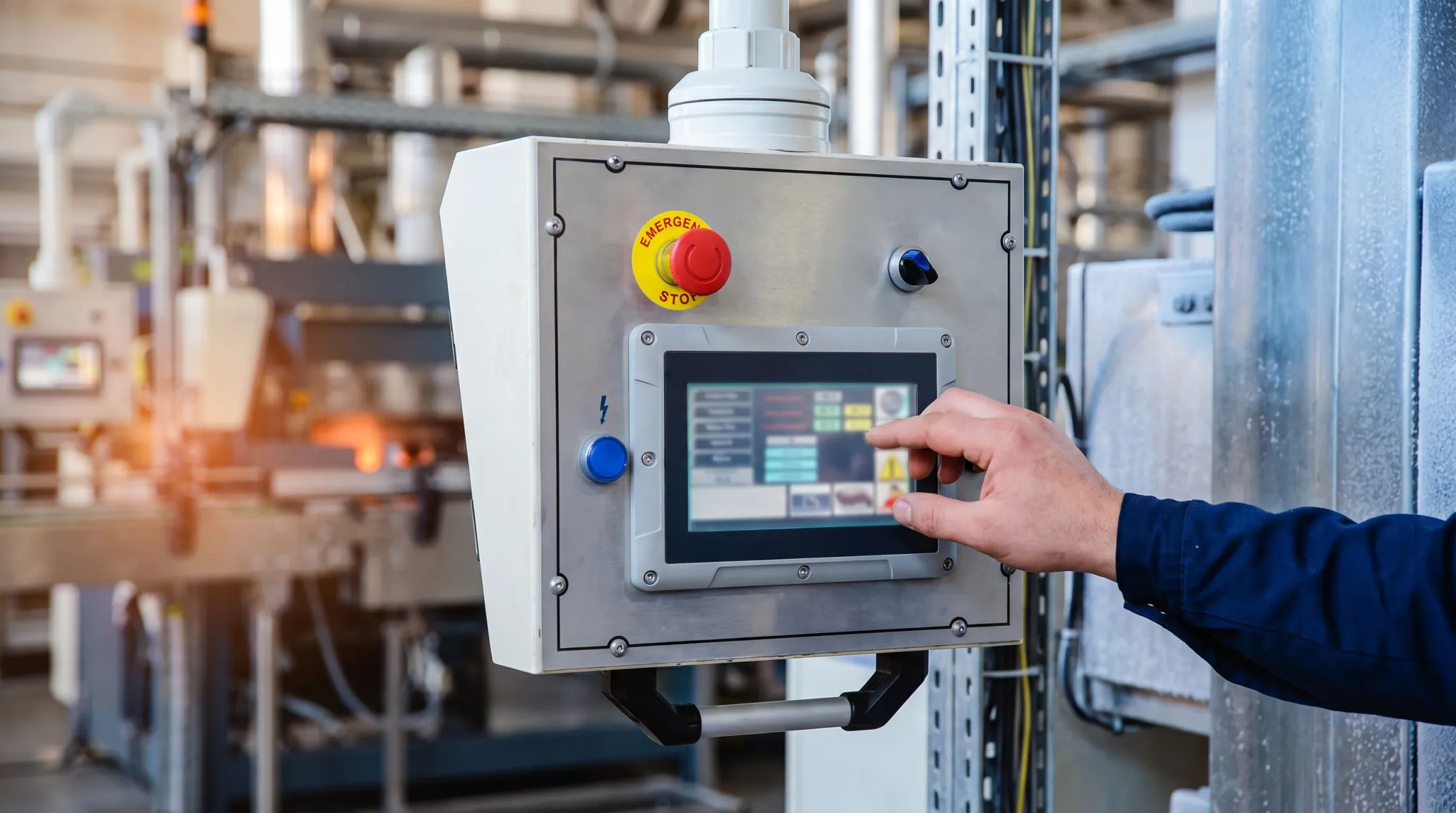 Industrial touchscreen monitor mounted near high heat production equipment