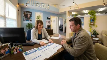 Local insurance agent helping client bundle boat home and auto coverage