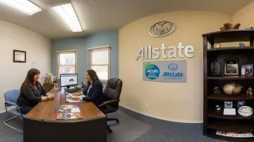 Santa Fe Allstate insurance agent discussing motorcycle policy options with rider