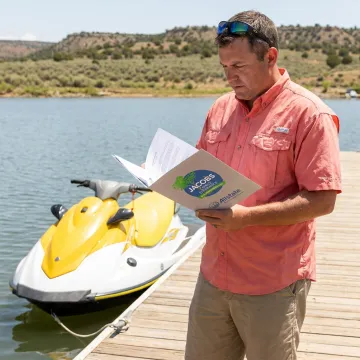 Jet ski on the water with insurance coverage concept